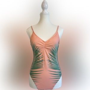 Xhilaration one piece swimsuit. Size M. Color coral with green leaf.
